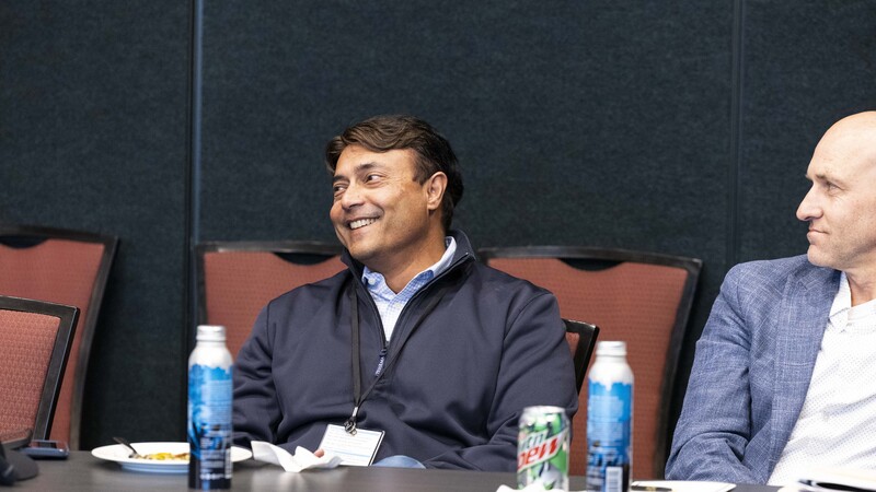 A CEO Exchange attendee smiling during a working session